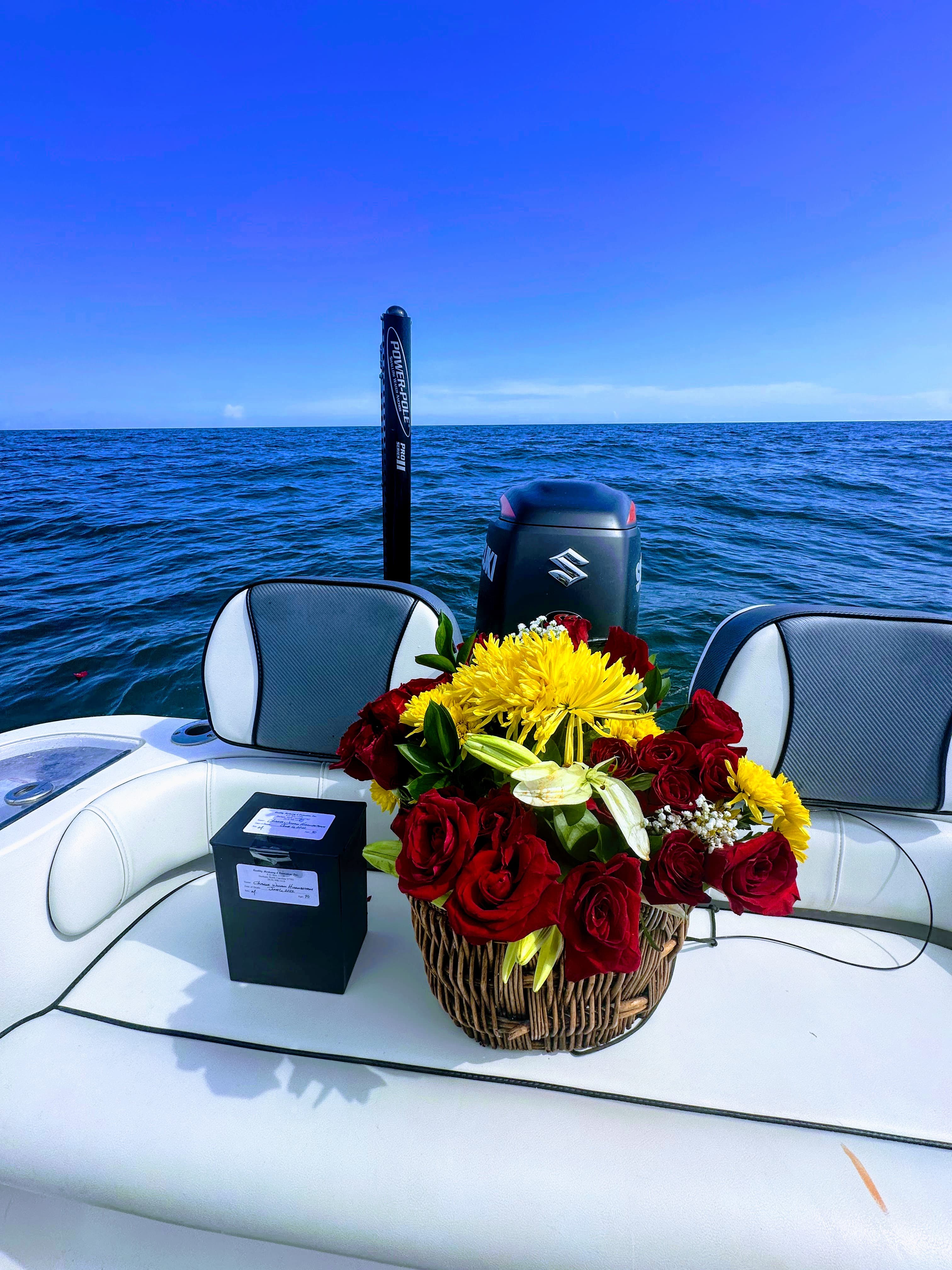 Flower basket resting on the ocean surface